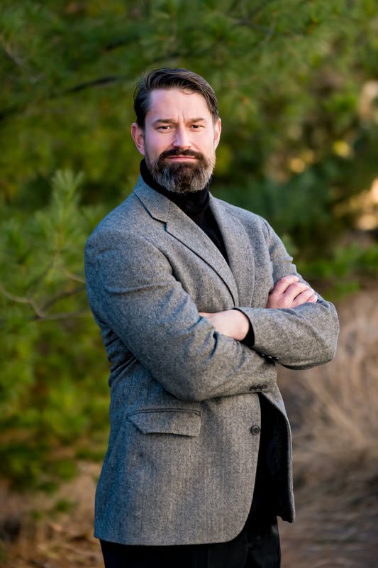 Brandon Stewart CEO of Nereus Systems wearing black turtleneck and gray blazer at City Park