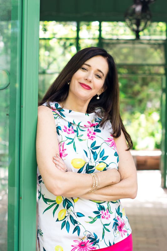 Portrait of Jayne at Botanic Gardens wearing flowered sleeveless blouse