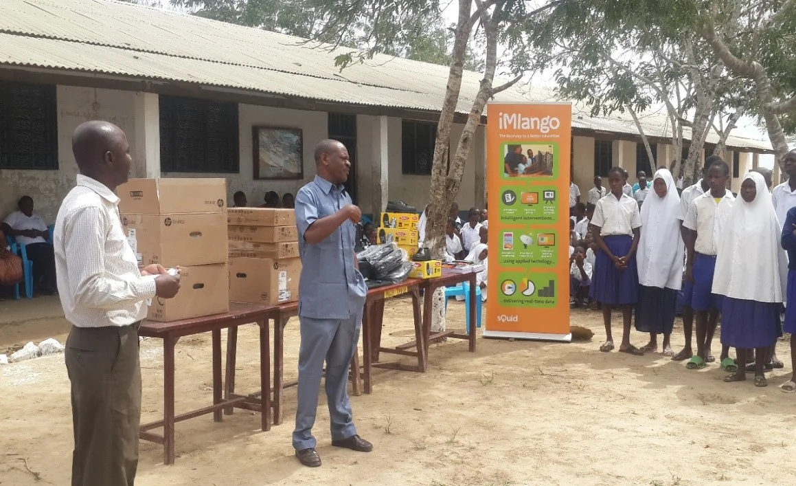 Headteacher (left) Mr Geresa Motto, and Community Support Officer of Mariakani (right), Mr Chimbungu Mwarumba address pupils and congratulate the winning group.