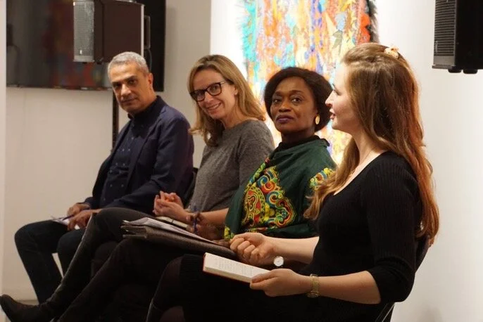 Four participants in a panel discussion