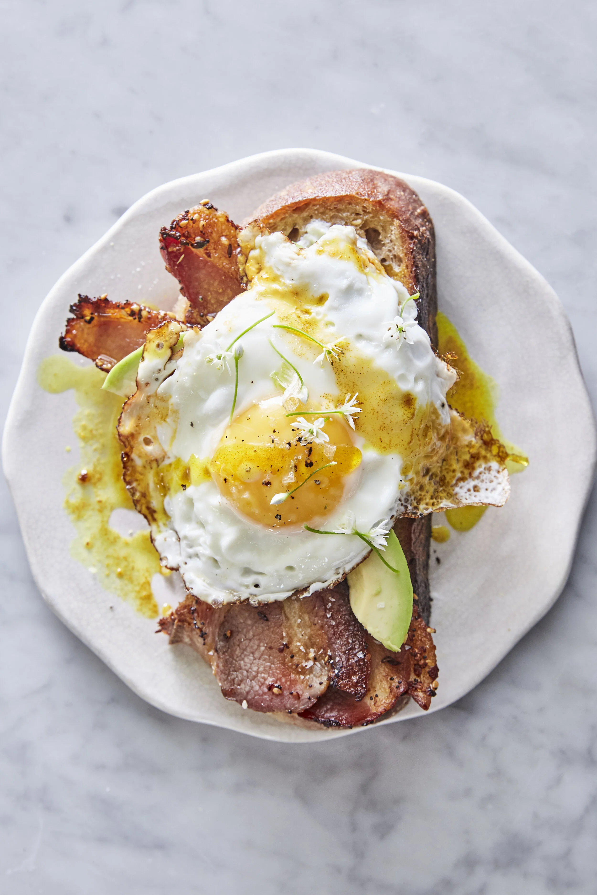 Bacon Egg And Avocado Toast With Turmeric Drizzle Edible Living My suggestion for a simple and tasty breakfast is toast with avocado, bacon. edible living