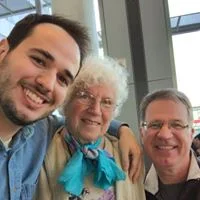 Rev. David (right), his son Luke and mother Joy.