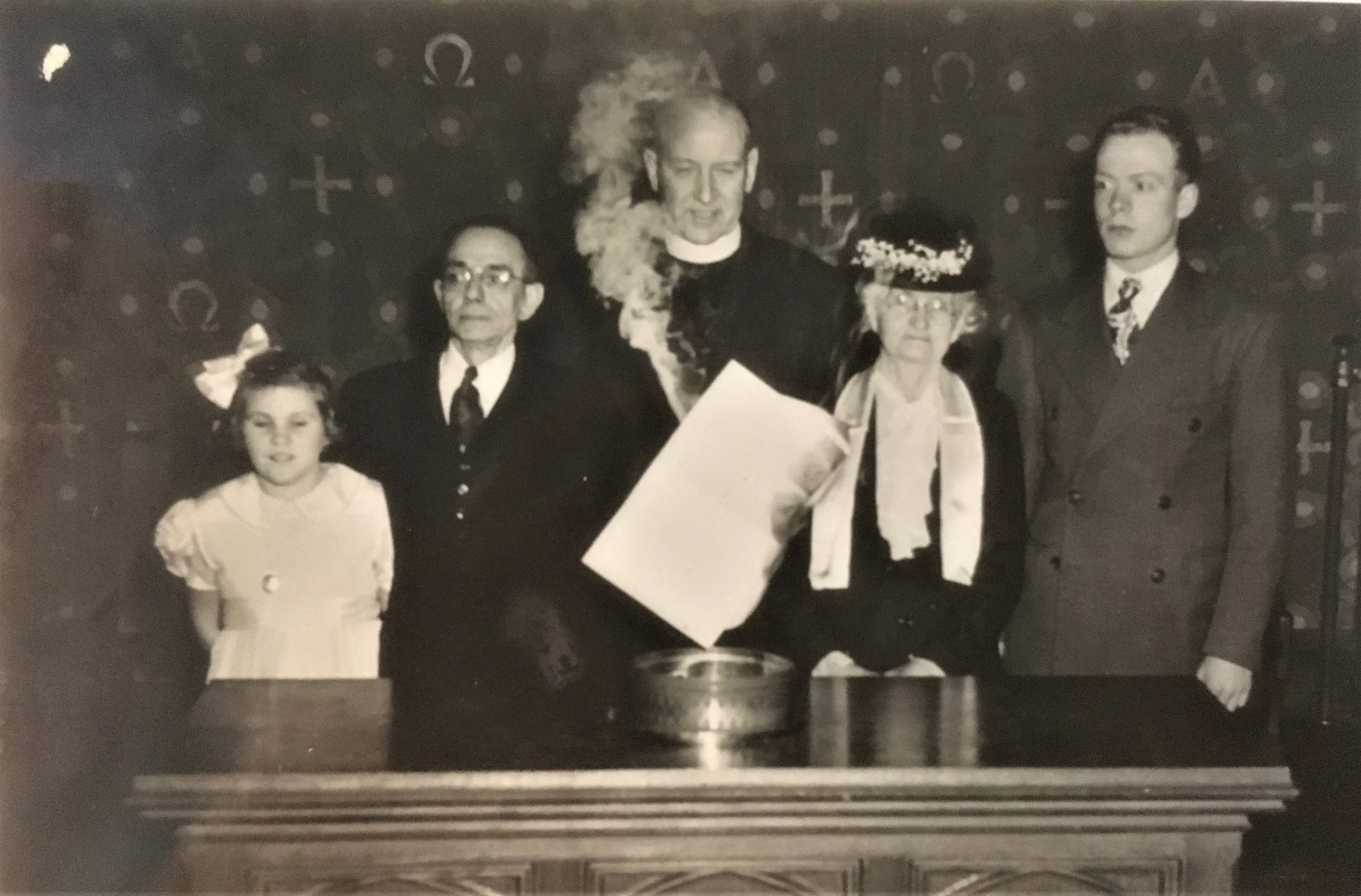Rev. Joyce sets fire to the mortgage deed, surrounded by (L to R): Marjorie Cooper, representing the Sunday School; Mr. Harris Way, Clerk of Session; Mrs. Clement King, oldest living member; and James Goodwin, representing Church Youth. 1947