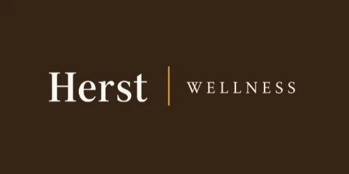 Herst Wellness logo with brown background and white and gold text