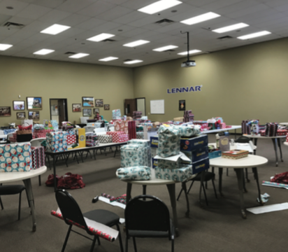 Presents from Lennar for Home Free residents ready for Christmas celebration.