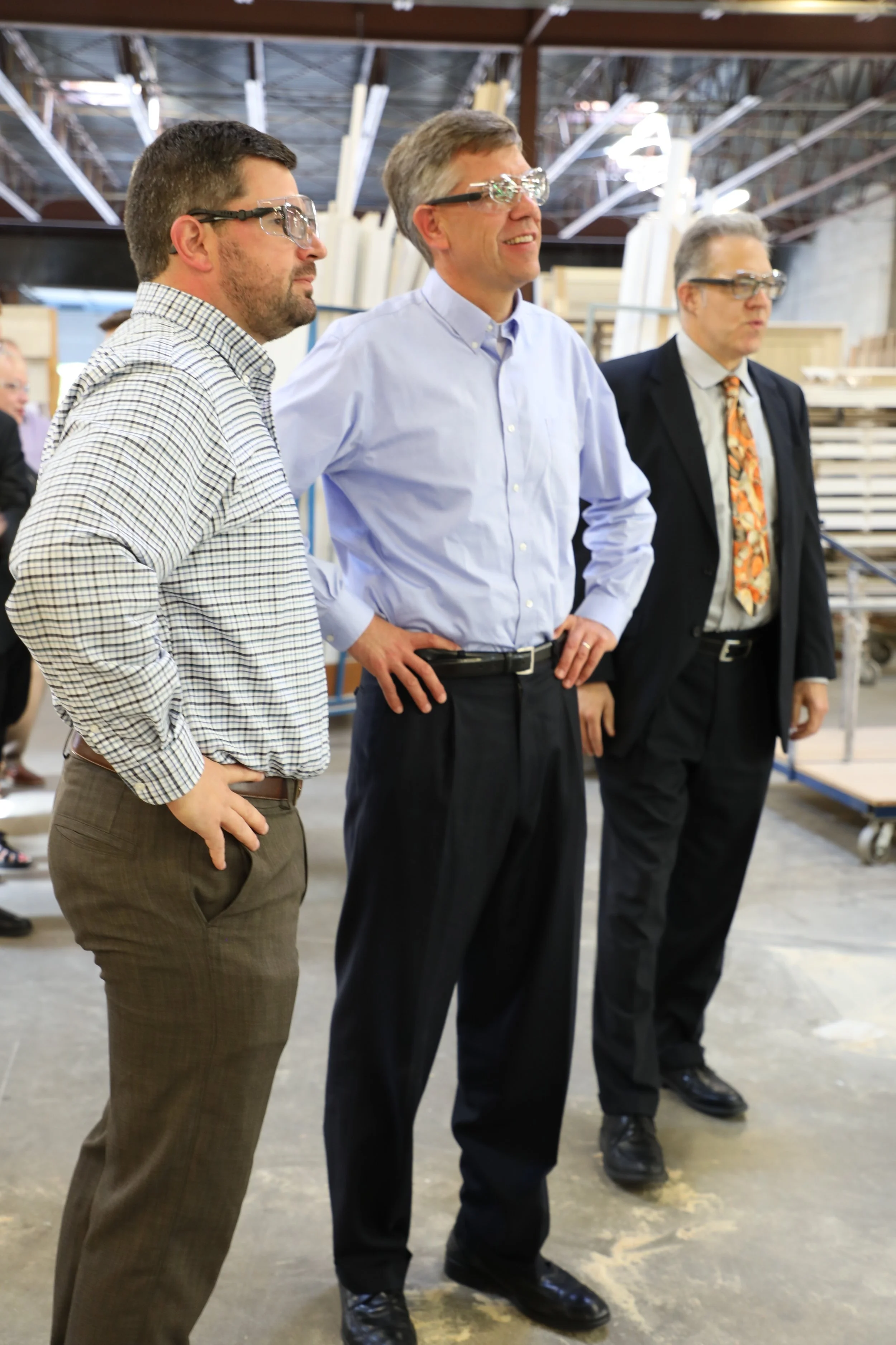 Housing First Minnesota board member, Charlie Bradburn, shows Congressman Paulsen (CD3-R) and David Siegel, Housing First Minnesota Executive Director, the ABC Millwork production facility.