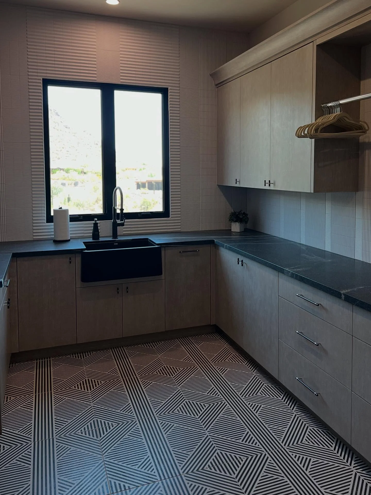 This laundry room is so pretty, you almost look forward to doing chores. Almost. 
&bull;Interior Design: KAM Interiors 
&bull;Tile: Facings of America 
&bull;Cabinetry: Goodall Custom Cabinetry 
&bull;Cabinet Hardware: Colonial Bronze 

#laundryinspo