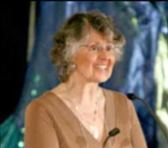 Picture of Sr. Alexandra Kovats at a microphone