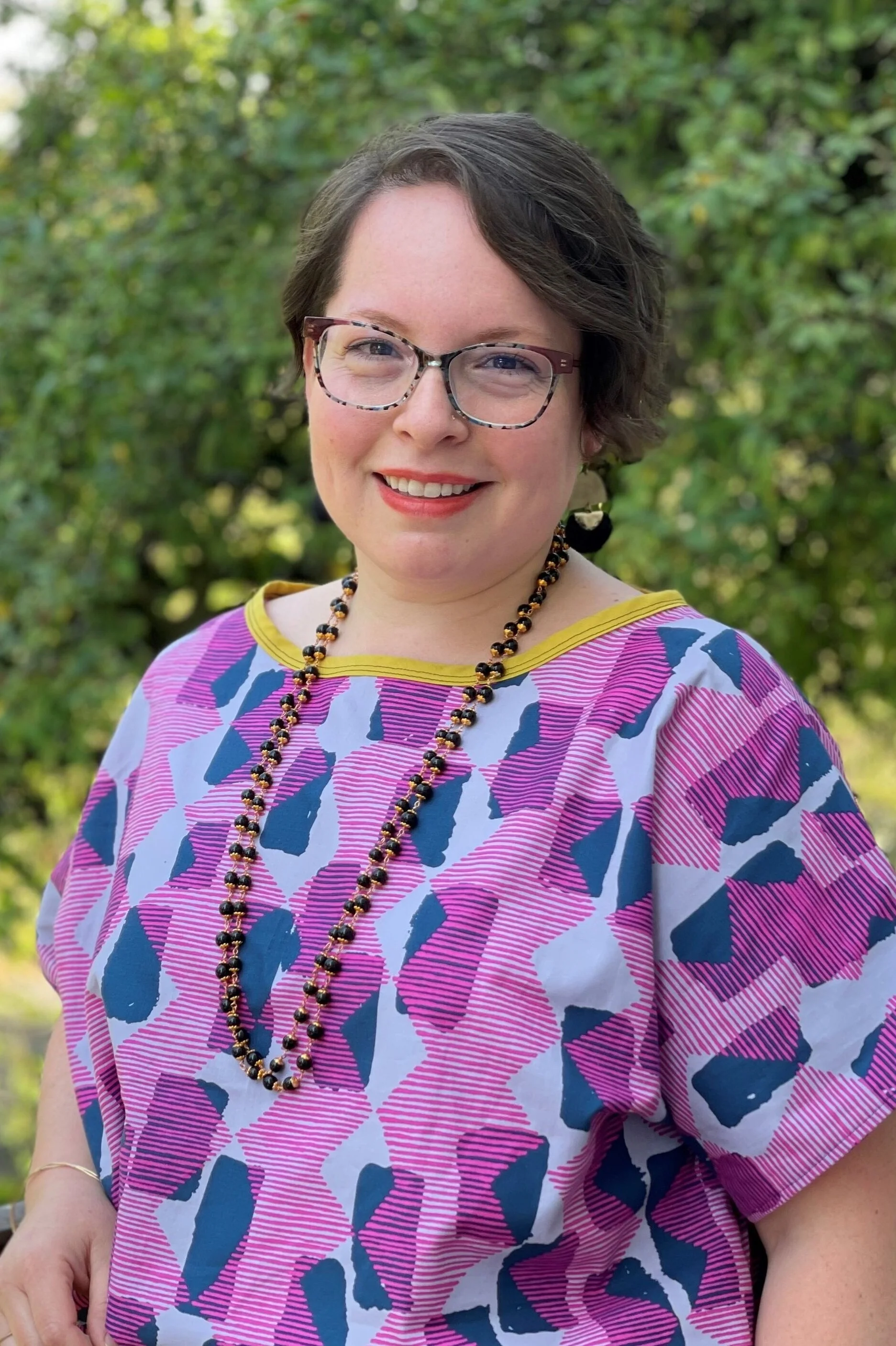 Picture of Maria in a brightly colored shirt