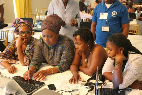 Participants learning hands-on how to create educational videos through an OMPT Video Education Workshop in Guinea