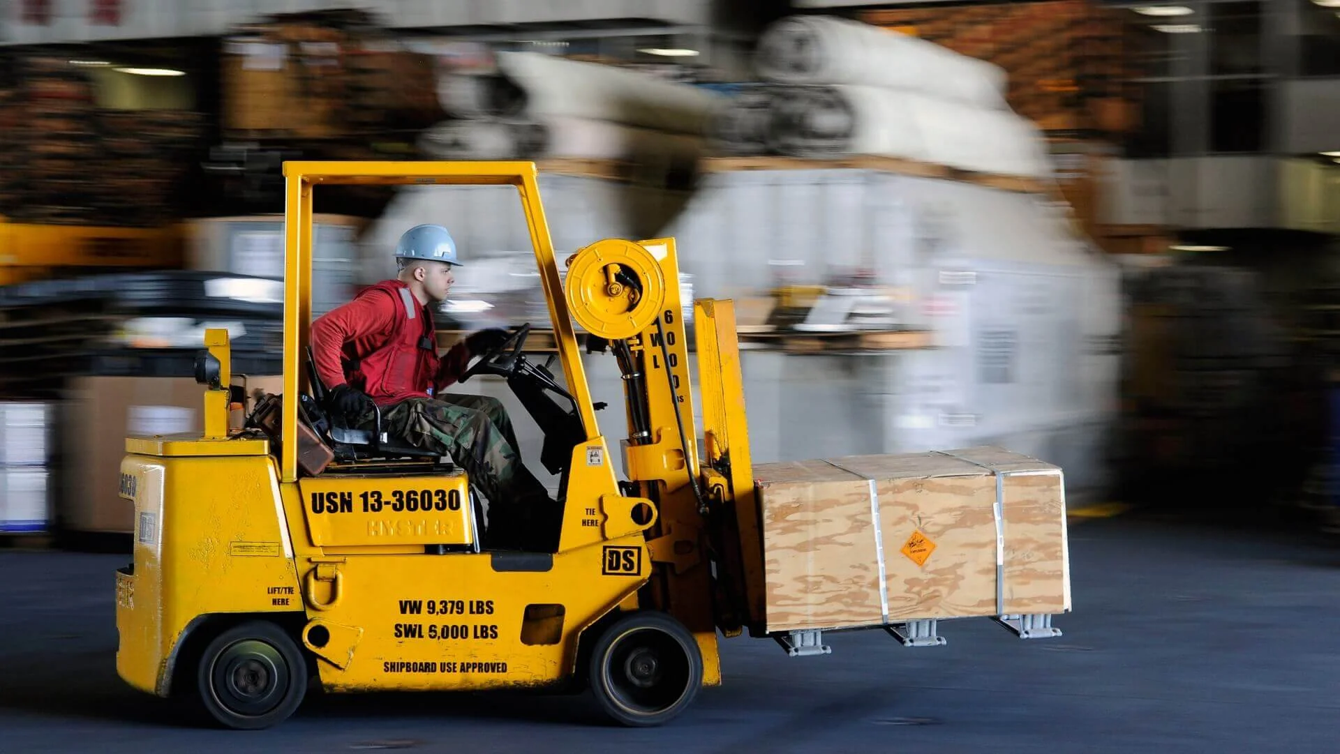 how-your-layout-can-reduce-forklift-accidents-featured-image-of-a-forlift-in-action.jpg