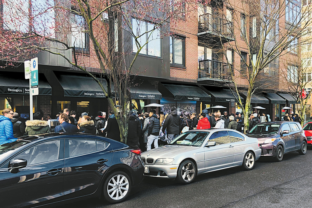 Prospective buyers line up at KODA's preview center for a chance to reserve a condo.
