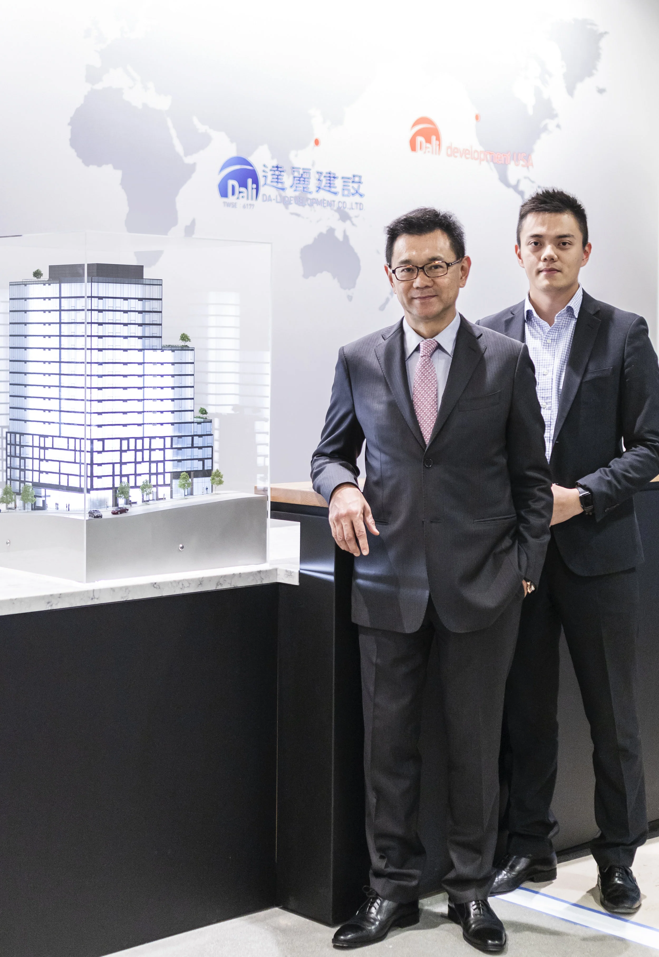 Da-Li Development USA Chairman James Hsieh, left, and his son and company Vice President Kevin Hsieh have opened a regional development office in Seattle's Pioneer Square. They're standing next to a model of Koda, a 17-story condominium project. Da-Li plans to break ground on the project this winter as it begins planning a second tower near the Space Needle. REALOGICS SOTHEBY'S INTERNATIONAL REALTY