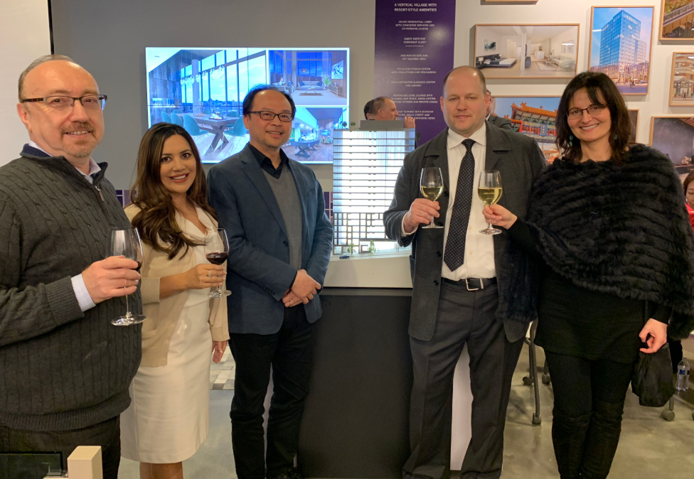 PICTURED ABOVE: Members of KMD Architects raise a glass in celebration of receiving the final design approval for the new high-rise, which now moves forward to issuance of its Master Use Permit.