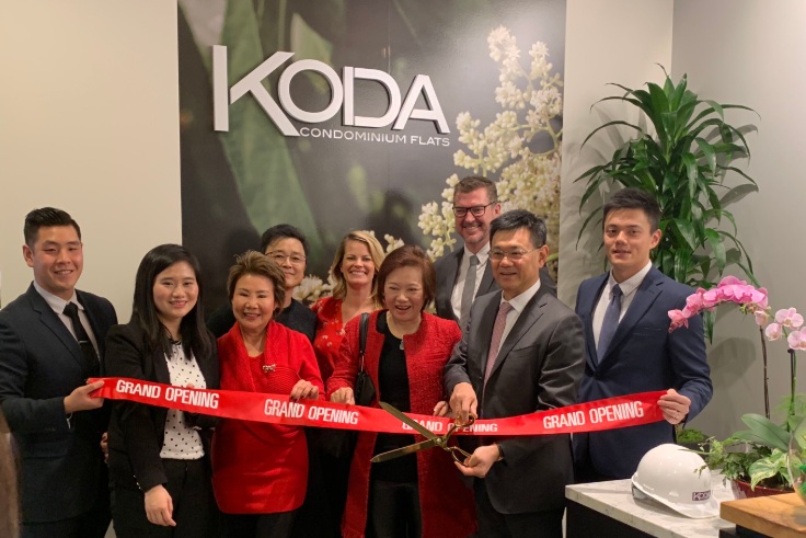 PICTURED ABOVE AND BELOW: Members of Da Li Development (above) and Realogics Sotheby’s International Realty (below) take turns with the ceremonial ribbon cutting of the new KODA Sales Gallery.