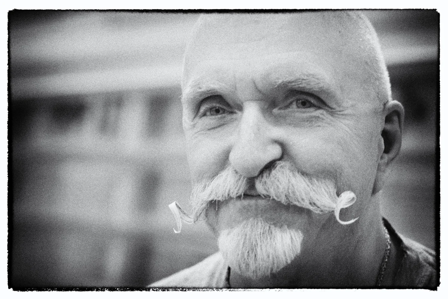 Old man with curly mustache portrait