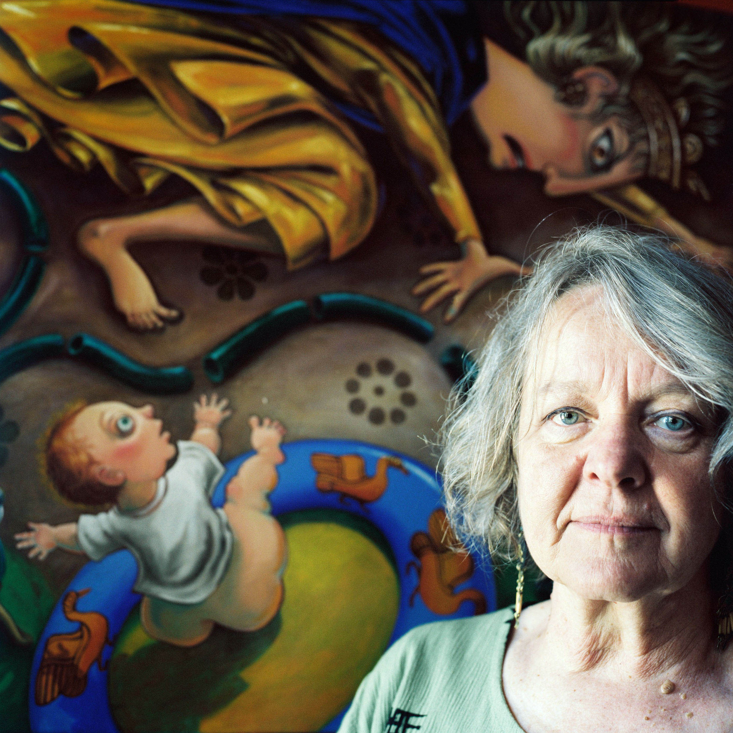 Janet Goodchild-Cuffley, with her painting "Demeter Introduces Stage IV Water Restrictions," Malmsbury, VIC, 2008. In this artwork, Janet draws paralells between Australia's cycle of drought and Demeter's act of witholding growth and fertility of the earth.