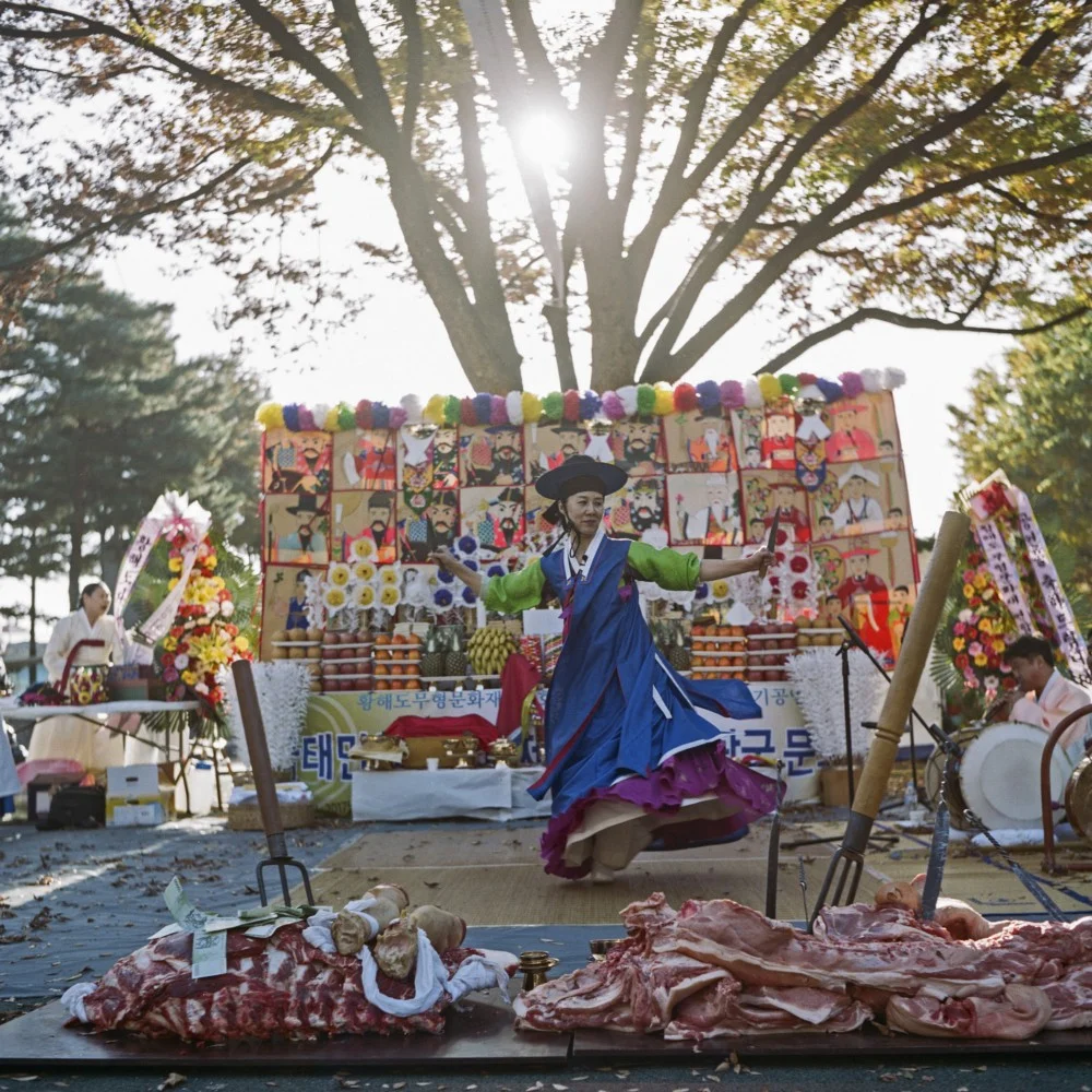 Manshin Min Hye-Gyeong carries out a public ritual at Namhansanseong Mountain near Seoul. She represents a younger generation of shamans who make good use of social media and other digital platforms.
