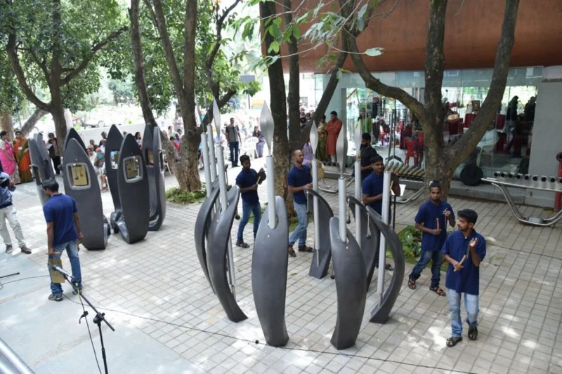 Outdoors, an interactive sound garden lets visitors make music of their own.