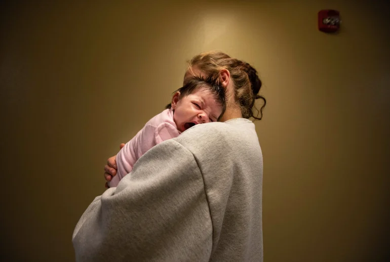 Cassandra Luthi and newborn Evelyn