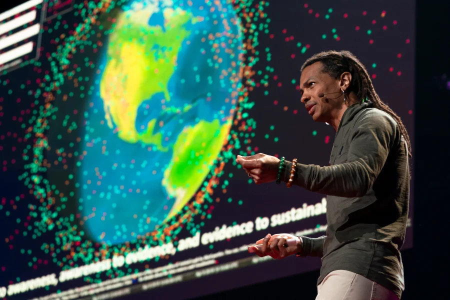 Moriba Jah shares a visualization of space junk during TED Fellows Session 2 at TED2019: Bigger Than Us, on April 15, 2019 in Vancouver, BC, Canada. (Photo: Ryan Lash / TED)