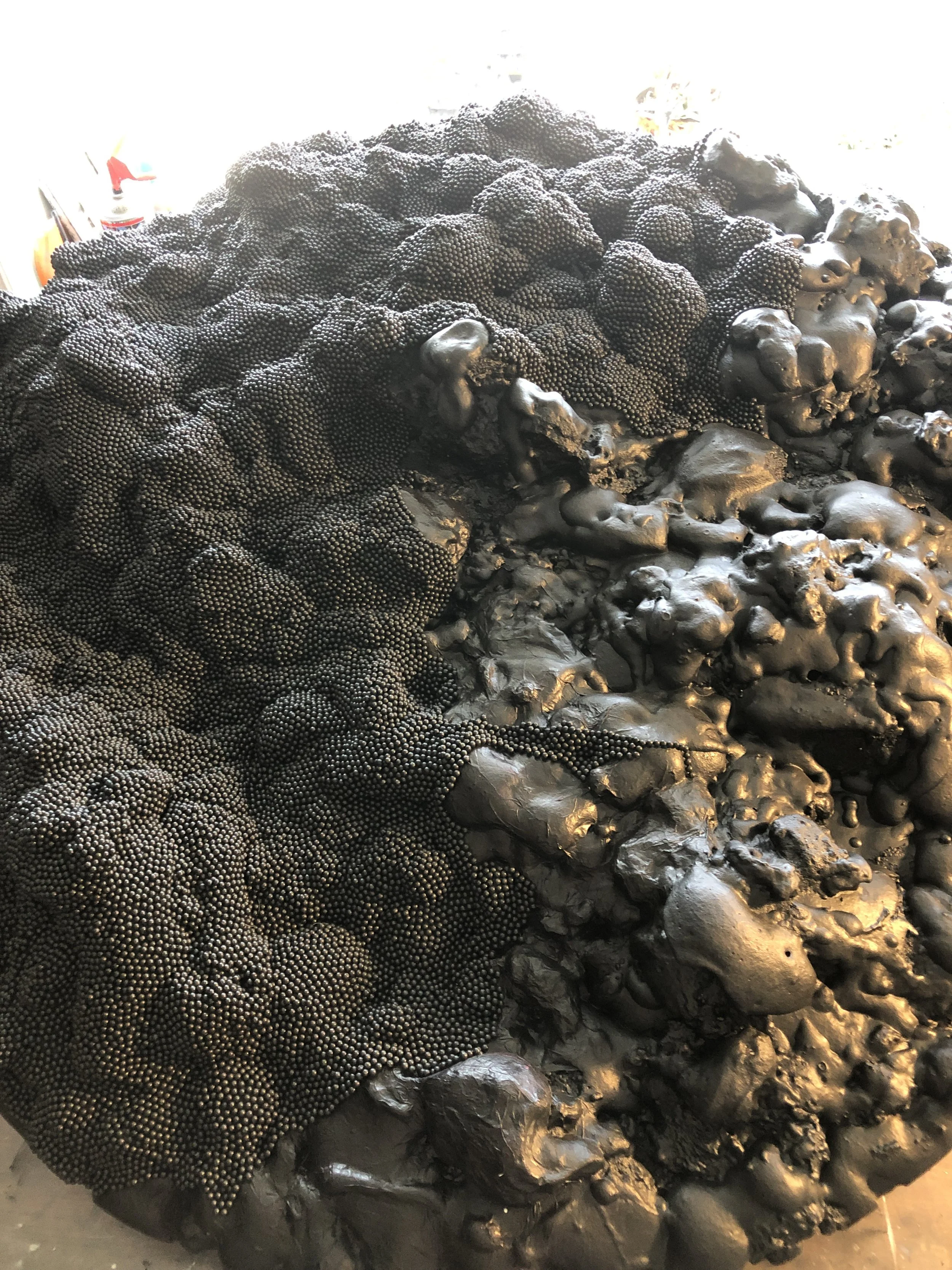 Midway through the completion of a large map pin piece.  The organic surface is built to secure the pins in place once placed. 