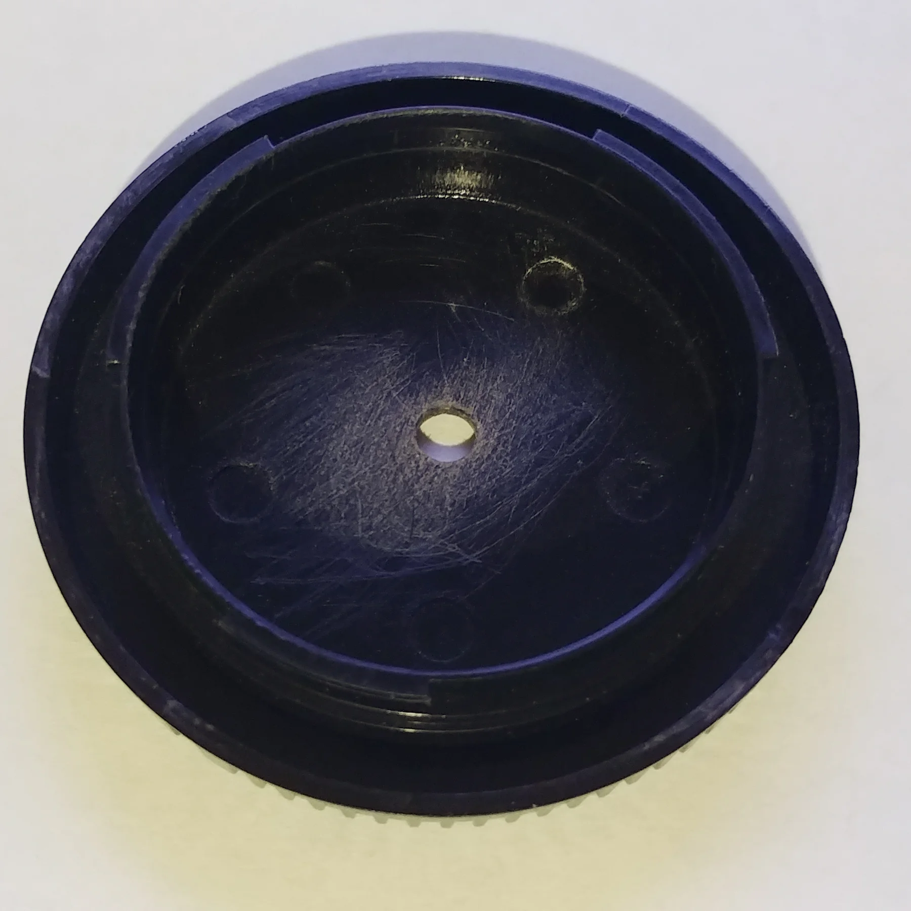 To start drill the hole in the center of the cap (it doesn’t need to be exact but get it close as you can) and sand off the rough edges (which can be seen on mine). Wash it and let it dry while getting everything else.