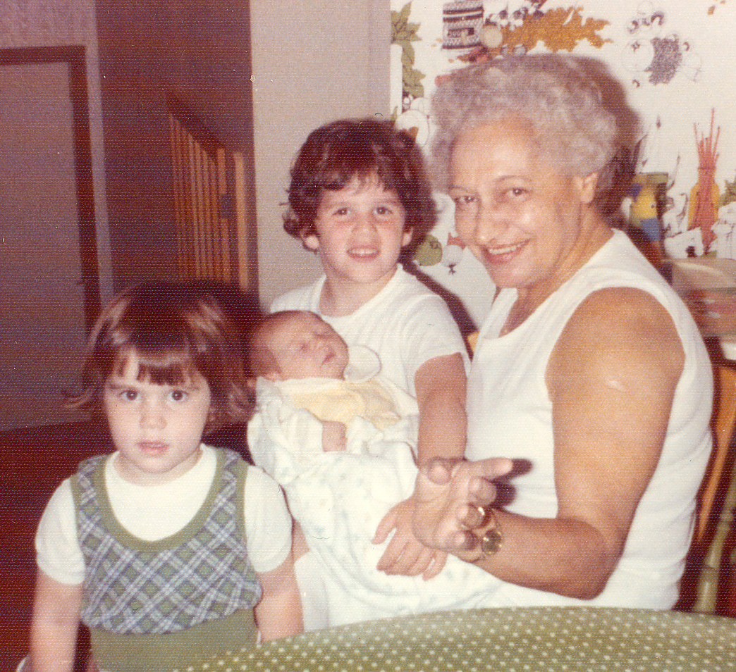 My grandmother, Philomena, with my sisters, Jill (left), Lori (middle) and me (in the back.)