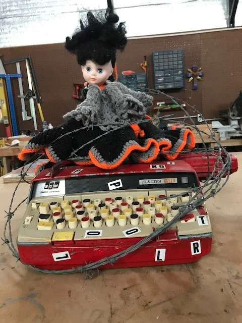 Doll on typewriter.JPG