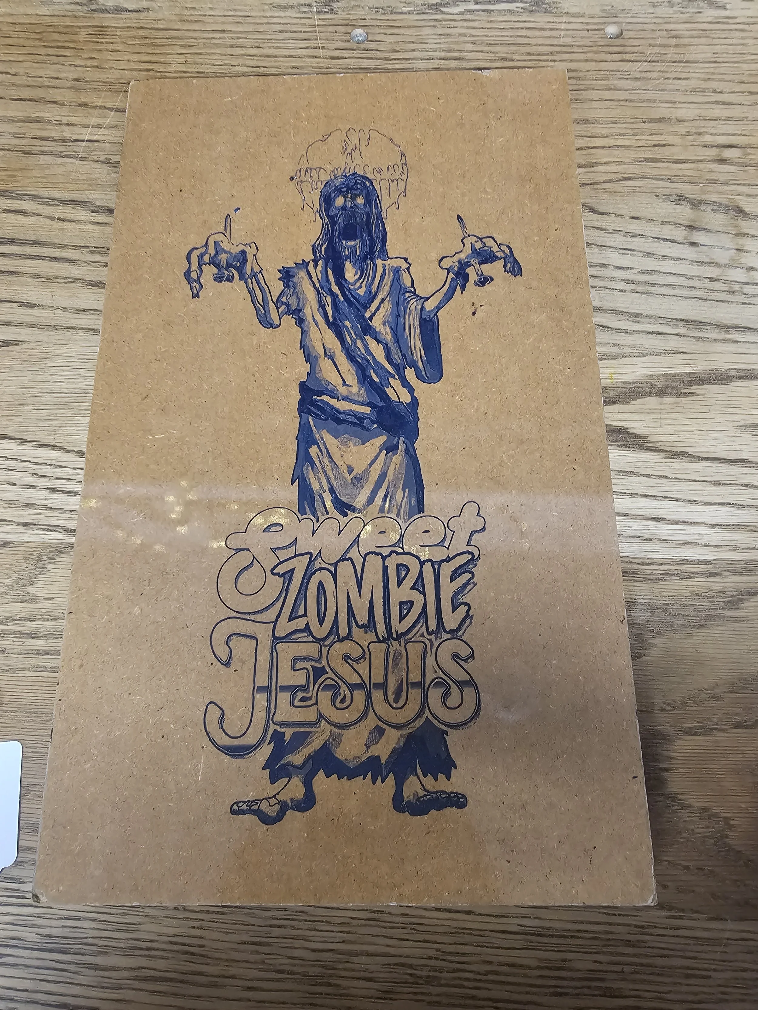 Sweet Zombie Jesus (2017) Paint filled Laser Engraved polished wooden Plank