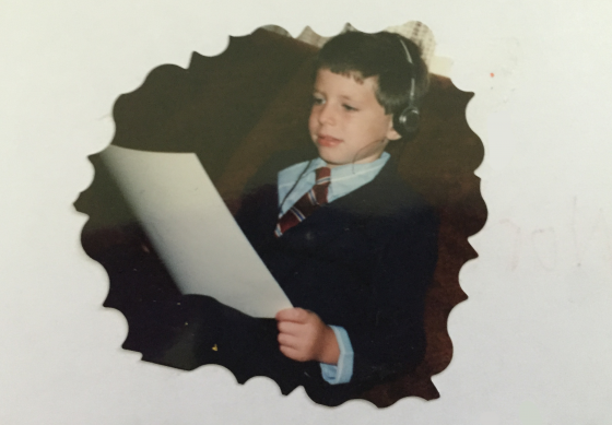 Little boy studies drumming music
