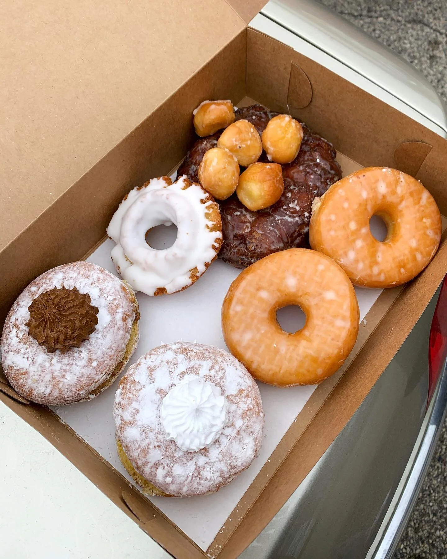 Donut bother me. 🍩 I&rsquo;m busy eating some @puffycreamdonuts !!!
 ⠀⠀⠀⠀⠀⠀⠀⠀⠀⠀⠀⠀
Clockwise from the top: Apple fritter topped with glazed donut holes, classic glazed, vanilla cream puff, chocolate cream puff, vanilla old fashioned 😋