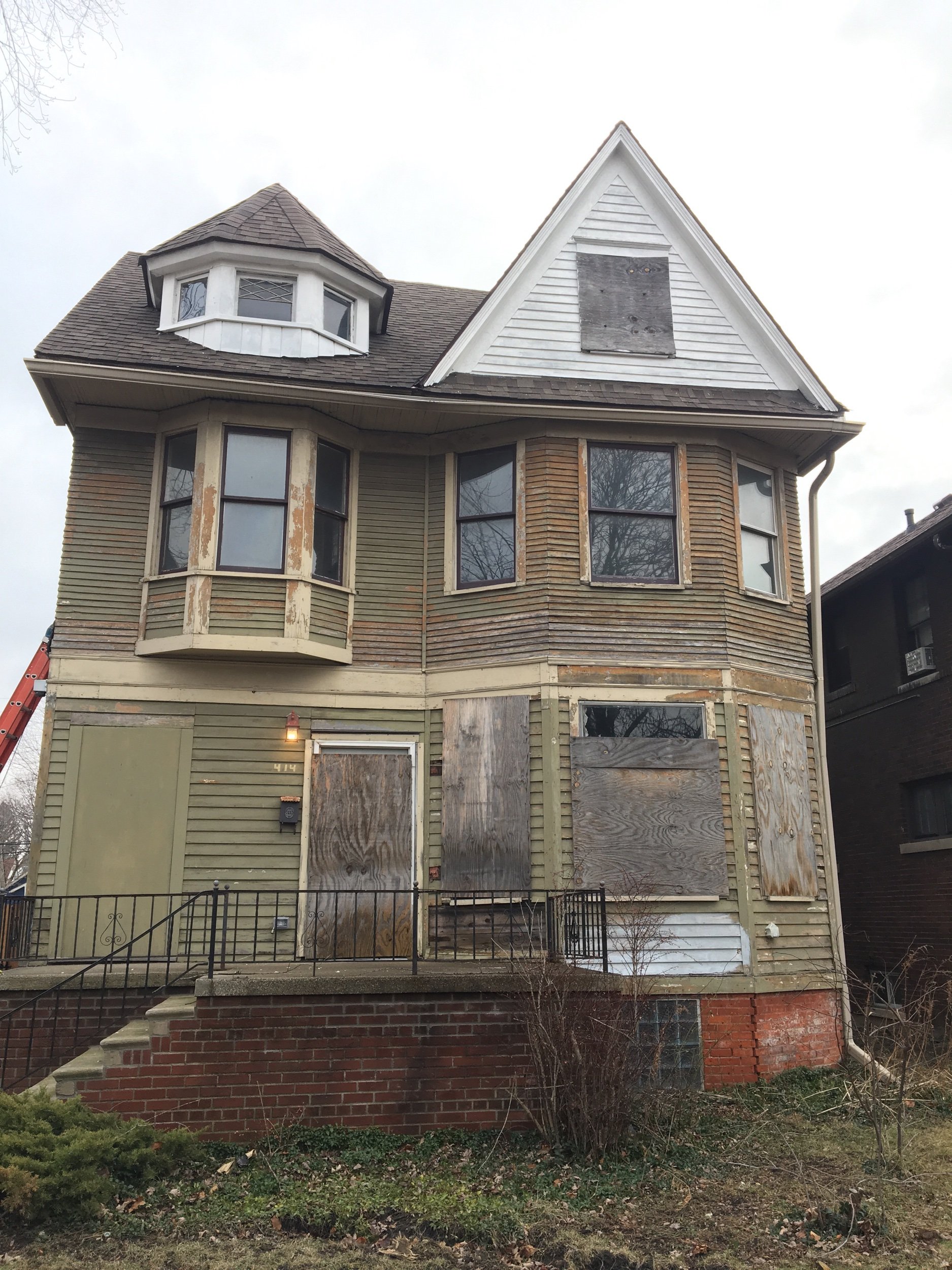 Painting and siding repairs, before picture