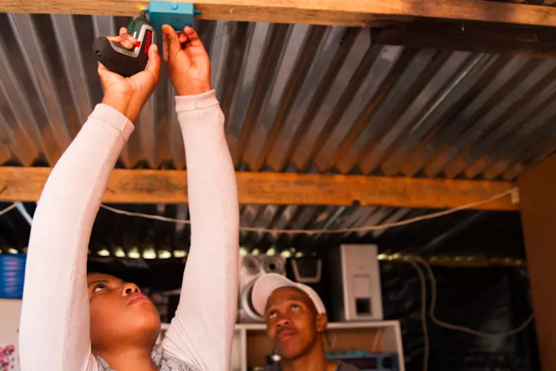 Installing the Lumkani device in a home involves two screws. Virgin/Sustainia