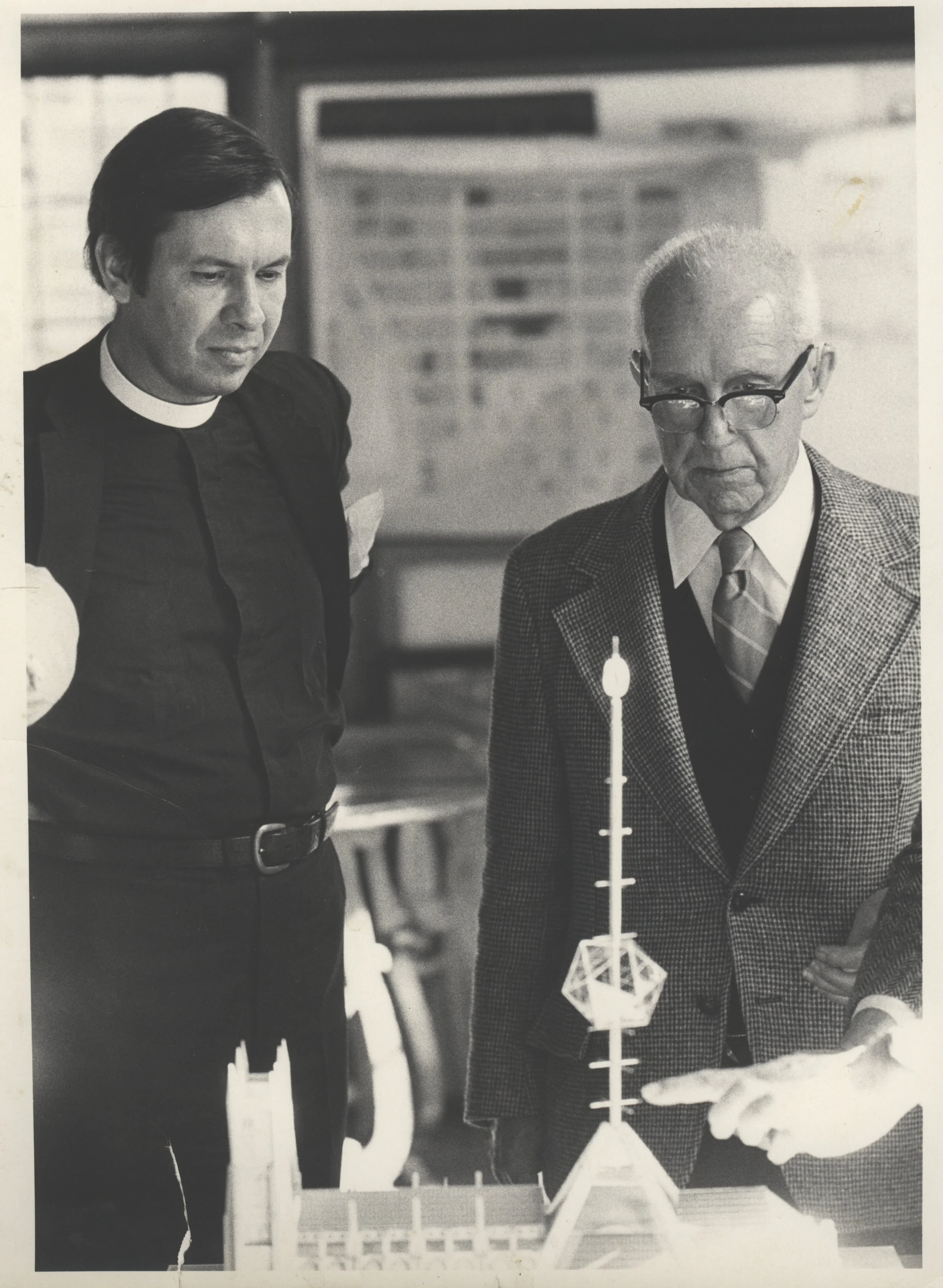 1980s: At the same time Dean Morton solicited designs to complete the whole cathedral. Here Buckminster Fuller stands with Morton showing a 600 foot spire piercing a geodesic dome. Credit: Episcopal Diocese of New York Archives