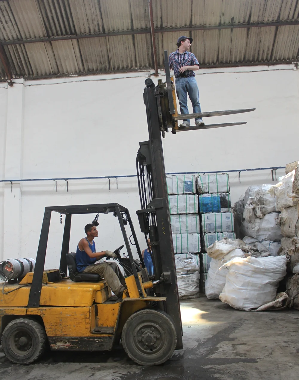 Adam demonstrates how not to ride a forklift.