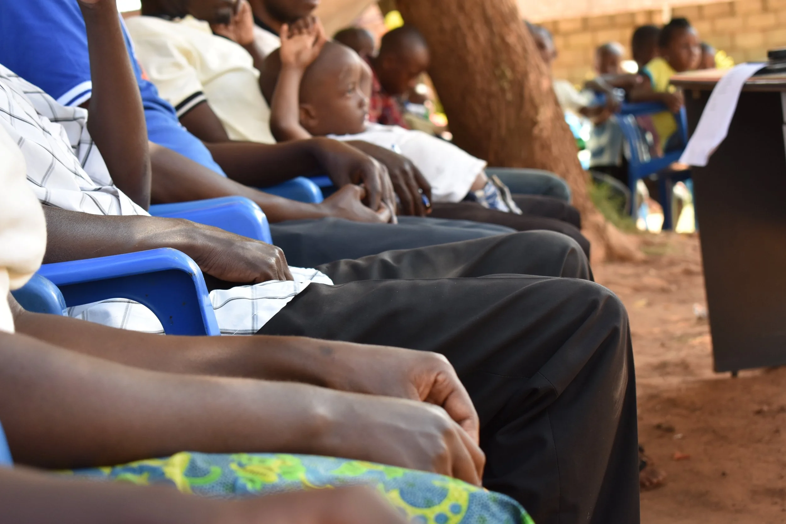 Members of HOCW listening to performances at the annual kid's celebration. 