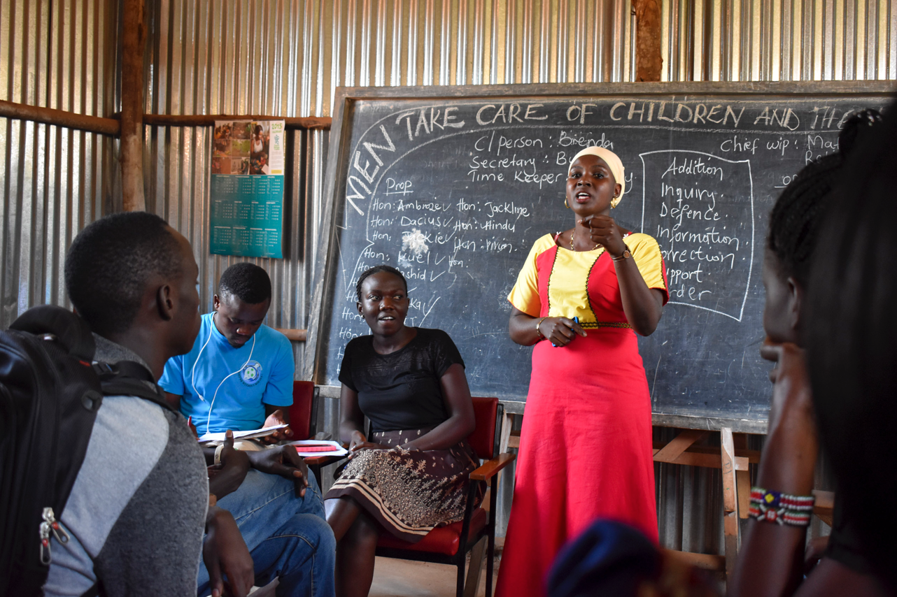 Teacher Hindu participating in a debate about gender equality. 