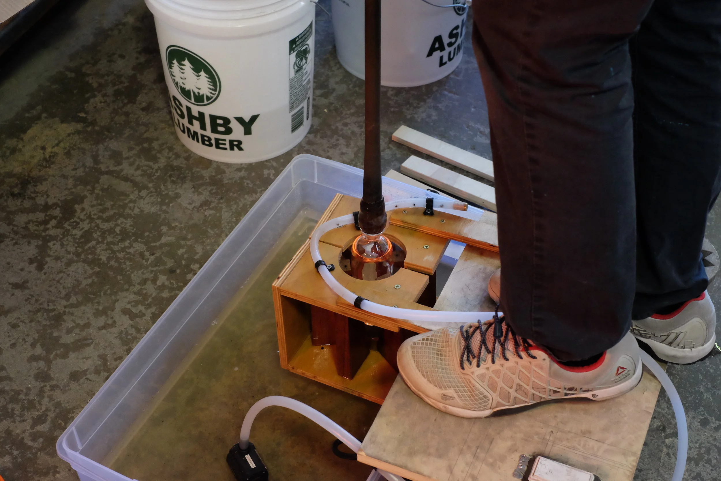 Blowing glass into the mold provides a precise shape