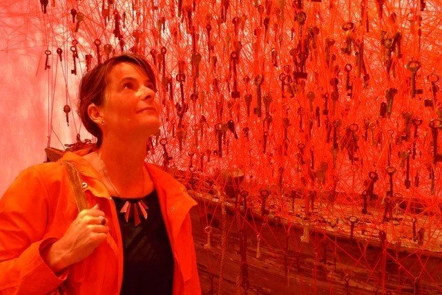 Marguerite at an art installation with hanging keys
