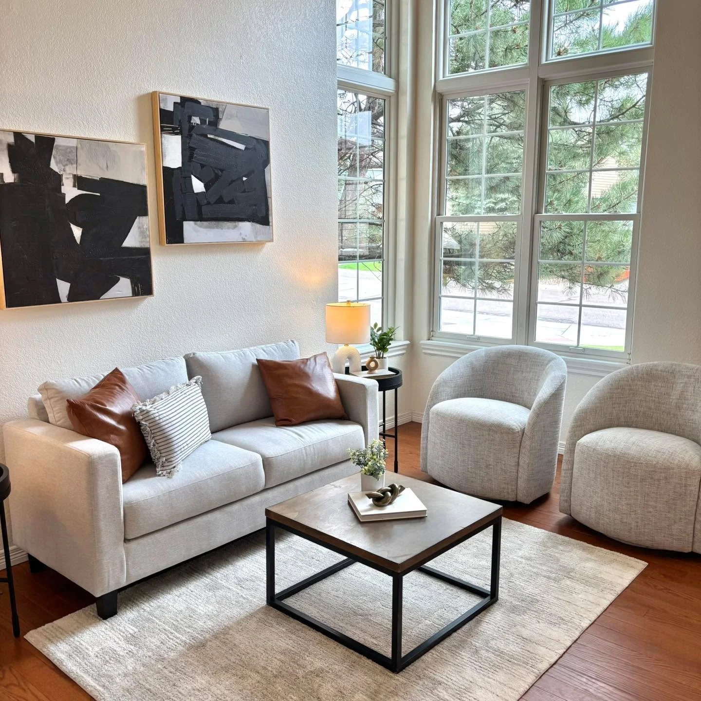 These windows!!! The windows in this room are a stunning architectural feature that completely transform the space. The grid-style design adds a touch of classic elegance while still feeling modern and airy. Because of their size and placement, they 