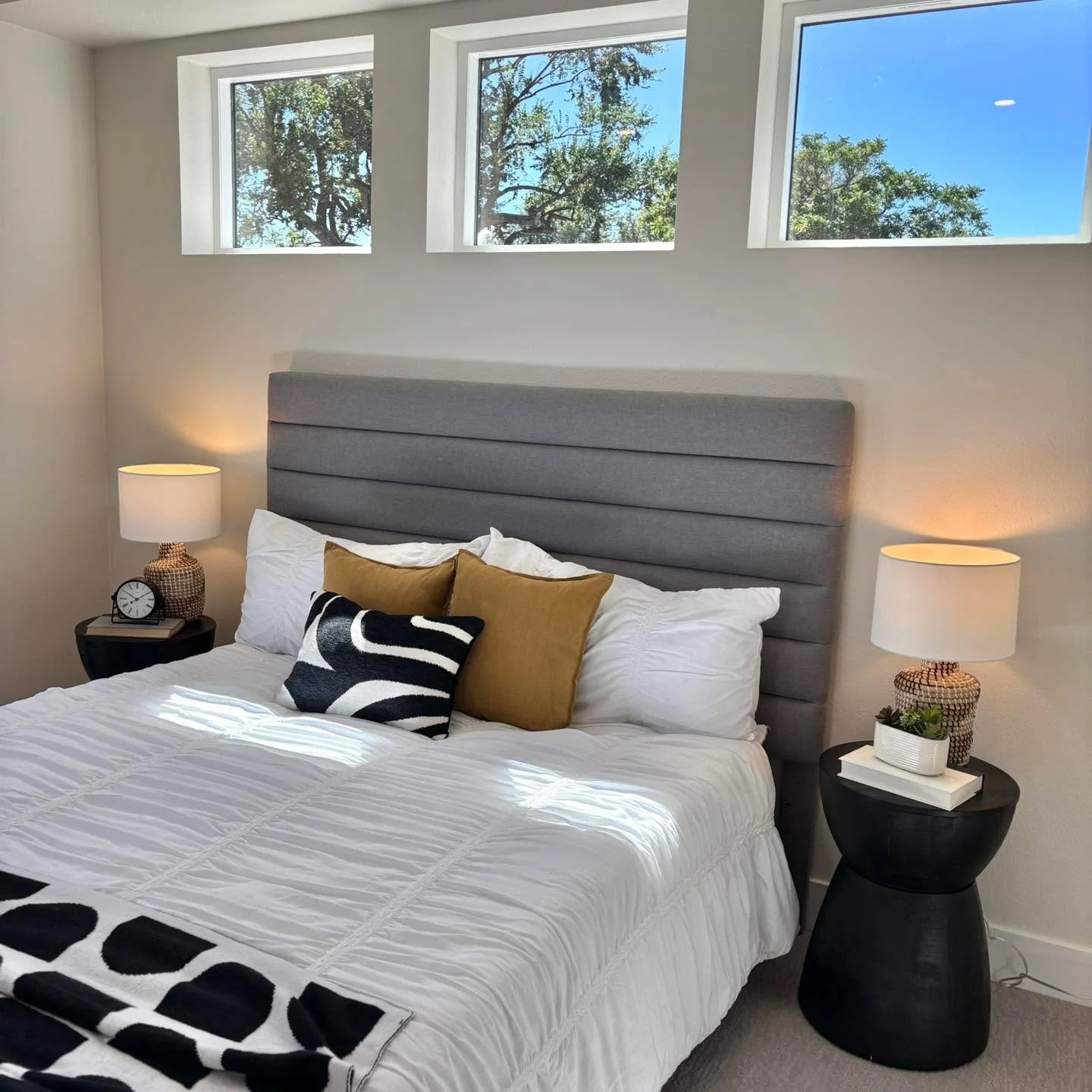 Just love how the windows bring in so much beauty and are the star in this bedroom. As soon as the leaves change, the scenery will definitely coordinate with the existing interiors colors too! We love fall! 🍁 

#5280magazine #acutedesigner #stagingw
