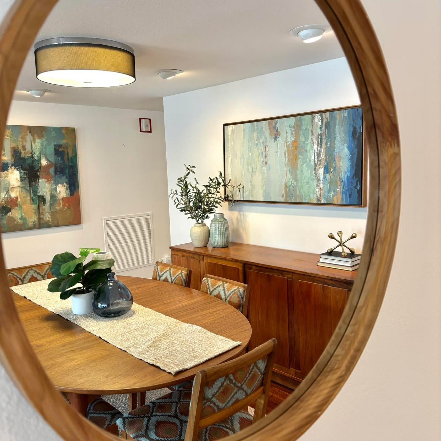 We love bringing in a little color when working with dark wood tones. This space already had some fun mid century dining chairs to incorporate into our staging plan as well. So this color palette was definitely part of our inspo! On the market now!! 