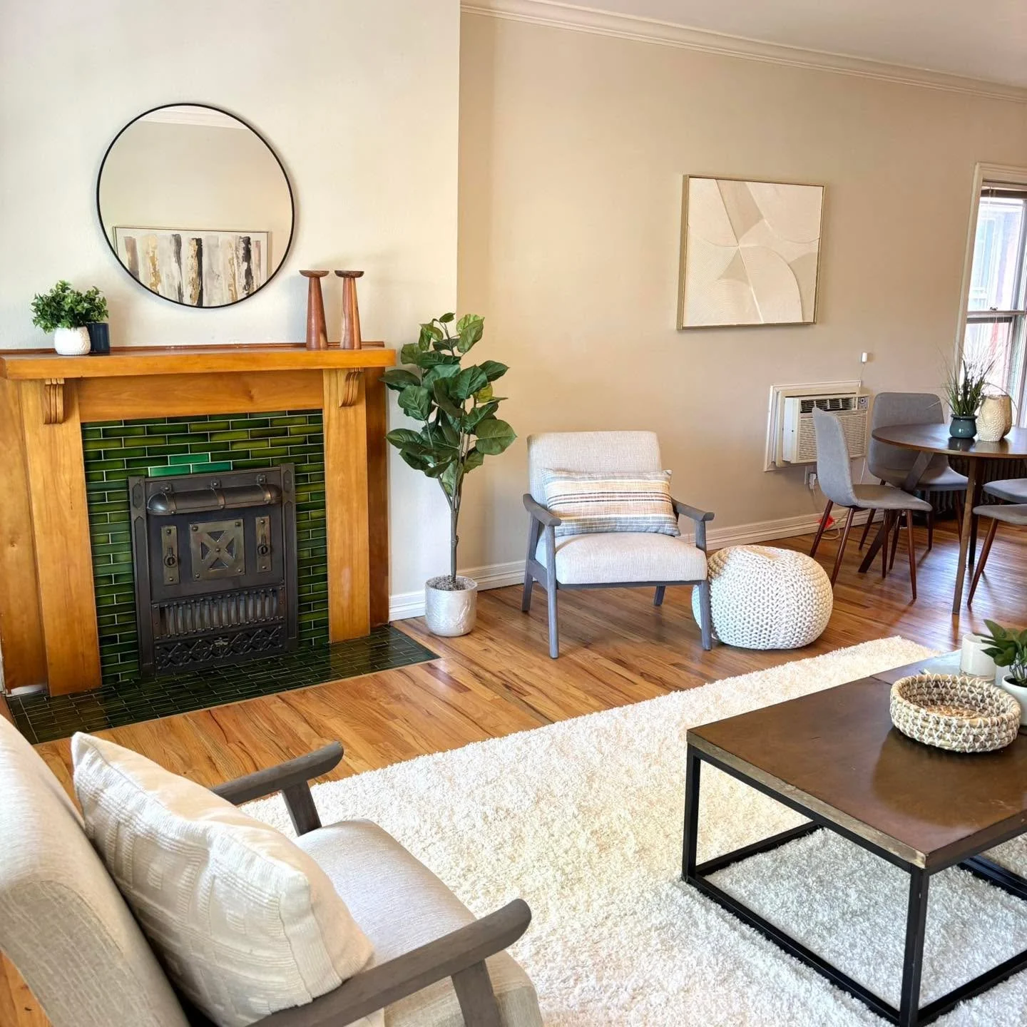 Right in the heart of the lovely Cheesman Park Neighborhood. Warm, inviting, and effortlessly styled ✨ This living space blends timeless charm with modern comfort&mdash;featuring a stunning fireplace with the classic, Denver historical rich green til