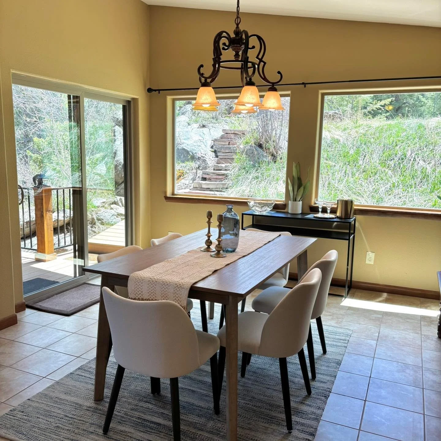 Mountain living meets modern comfort ⛰️✨ This home was designed and staged to highlight the peaceful surroundings while creating a warm, welcoming place to gather. With natural light pouring in, earthy textures, and views that bring the outdoors insi