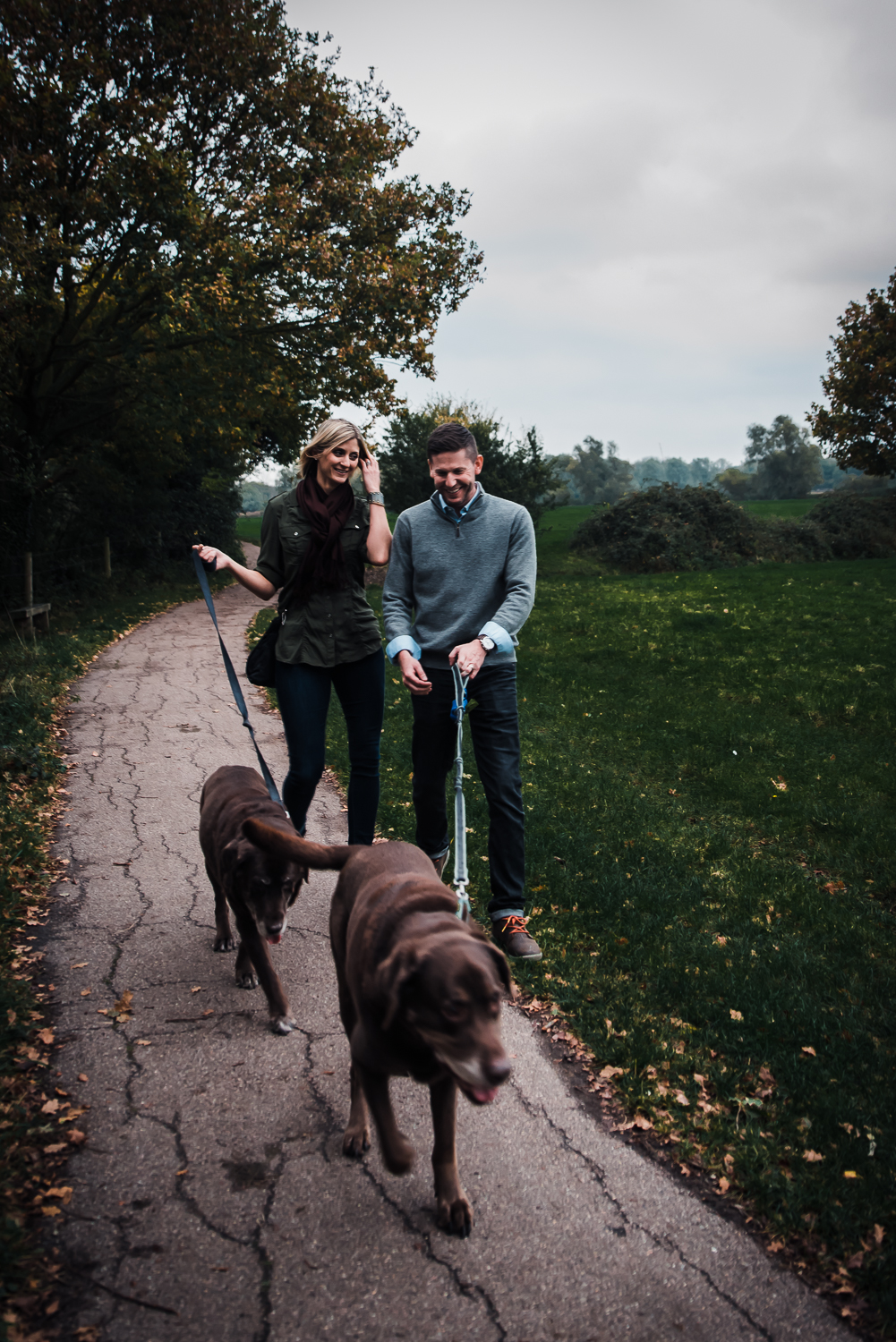  Natural and relaxed portrait of a couple on a dog walk 