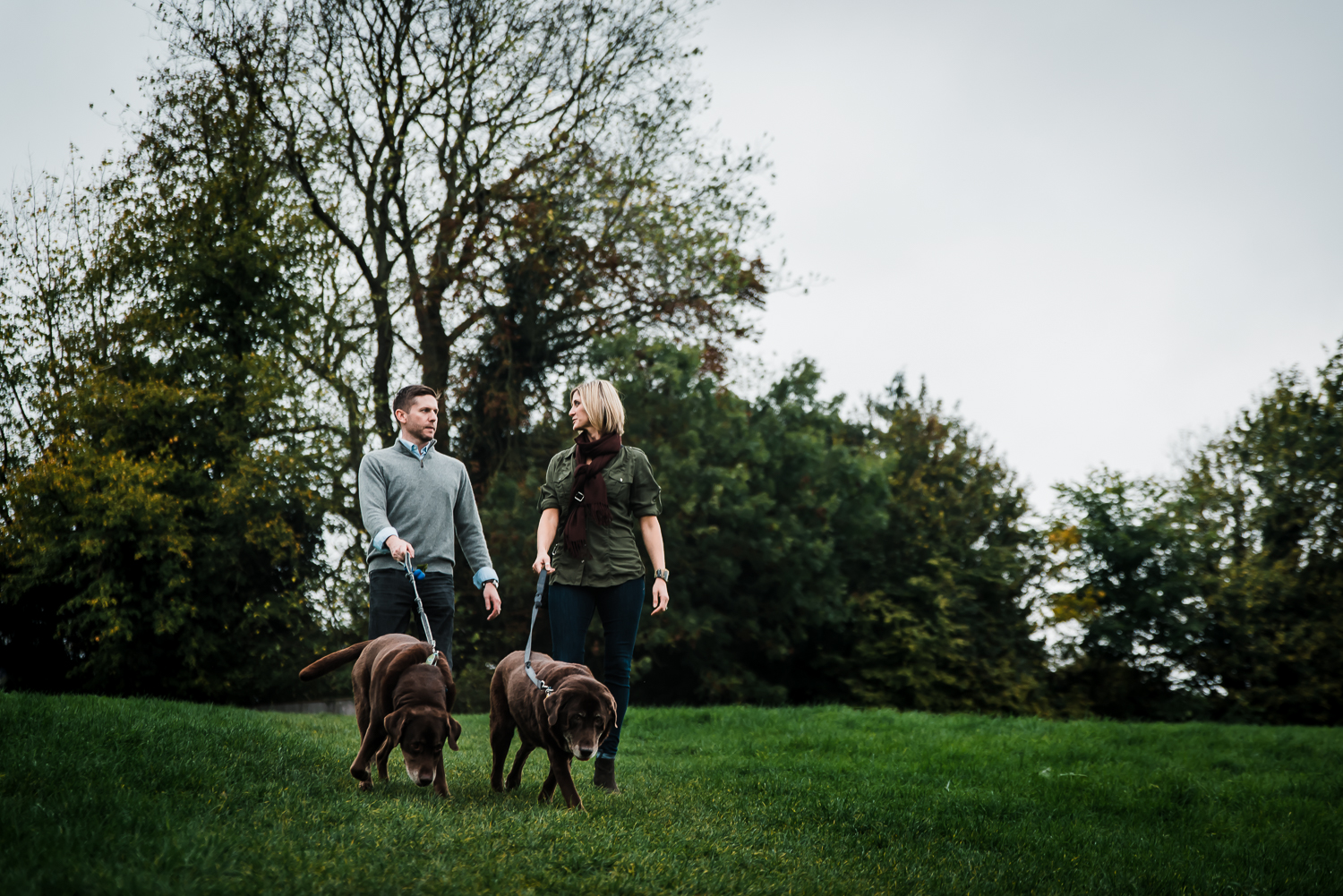  Couple taking dogs for a walk at Grantchester Meadows 