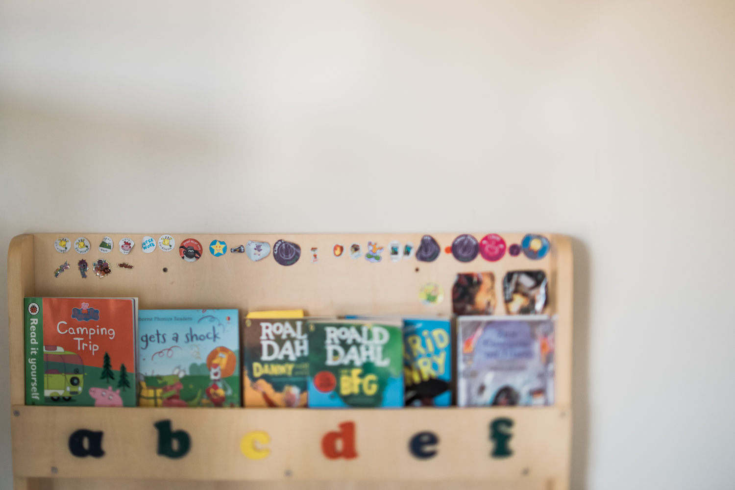  sticker collection on child bookcase 