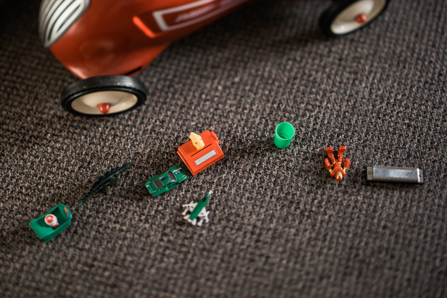 Copy of red and green children toys laid out on floor