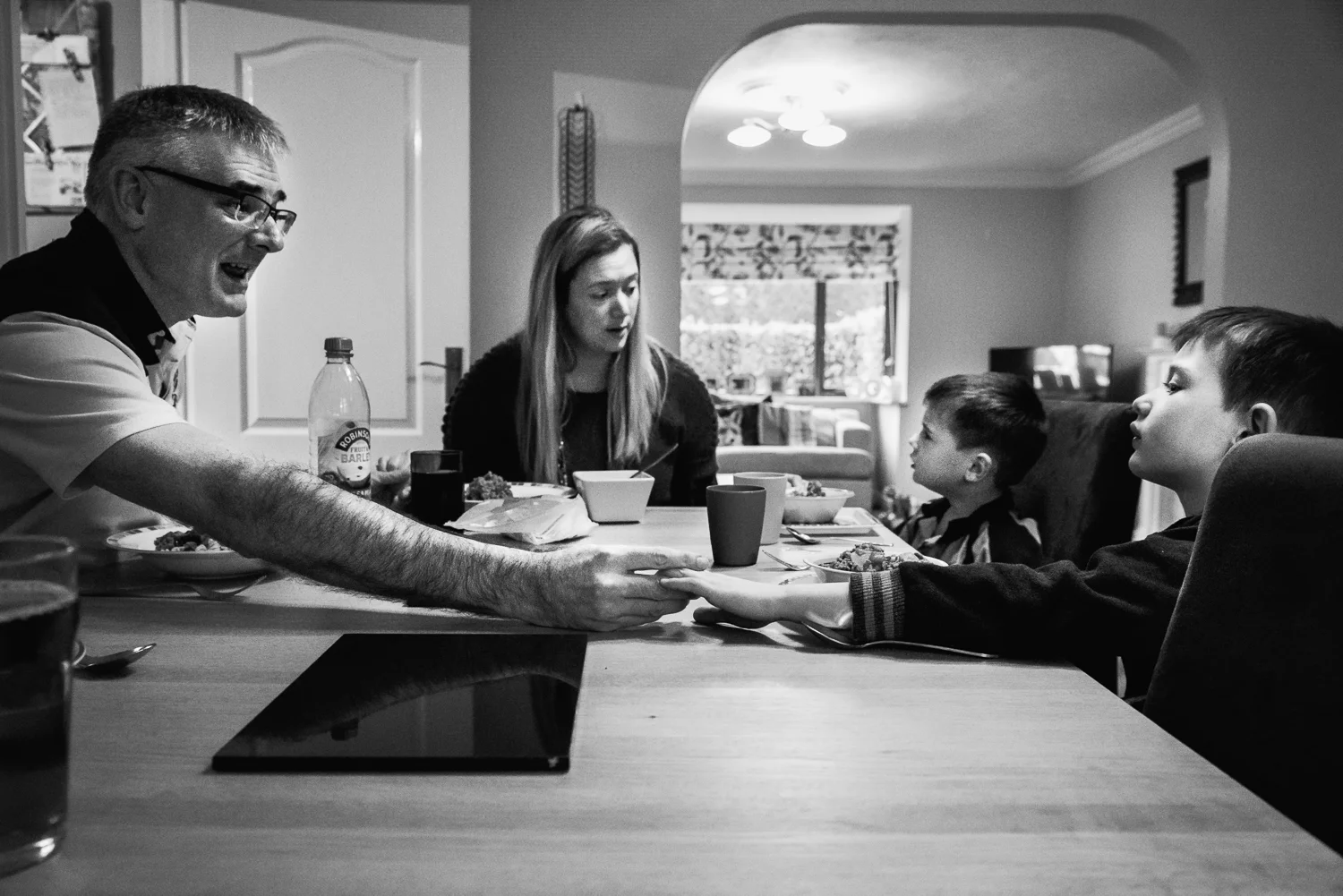 Copy of Family sitting down to a meal